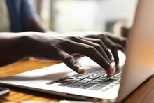 Image Of Hands Of African American Man Working On Laptop