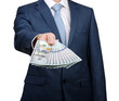© Alekss - Businessman holding money cash in hands of passing them to the client.