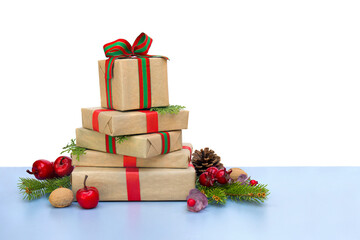 Wall Mural - christmas decoration. gift boxes, christmas tree branch, red berries, apples, cones, nuts on blue ta