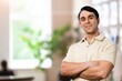 © BillionPhotos.com - Successful Person. Portrait of confident smiling business man standing in modern coworking office hall, posing