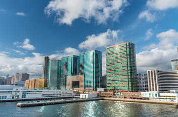 Wall Mural - Pier and modern office building in downtown of Hong Kong city