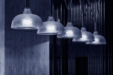 Poster - Row of pendant light lamps set in modern interior