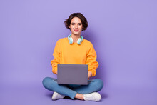 Full Length Photo Of Nice Satisfied Person Sit Use Netbook Write Email Coworking Isolated On Violet Color Background