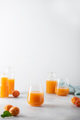 Canvas Print - Summer apricot juice on the light background