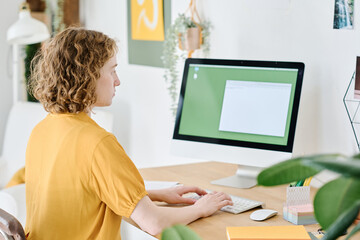Aufkleber - Young female freelancer or designer sitting in front of computer monitor while working over new online project or creating website