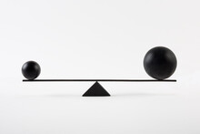 Black Balls Balancing On Scales