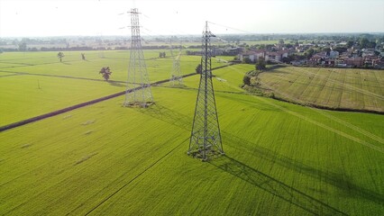 Italy Drone view of Power Plant in Lacchiarella near Milan in the Po Valley- High voltage pylons for the production and transport of energy - energy crisis to increase gas costs and petrol oil energy 