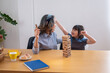 © PHAISITSAWAN - Grandmother and granddaughter play games. Blockwood Puzzle To develop skills for granddaughter and as a holiday activity
