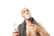 Сlose up view of a bald man brushing his teeth with toothpaste with emotions isolated on white background.