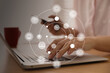 © New Africa - Internet marketing. Different virtual icons and businesswoman working on modern laptop at table, closeup