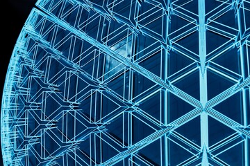 Poster - abstract background. a large sphere on a black background consisting of patterns of triangles illuminated with blue neon light. 3d render. 3d illustration