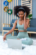 © kanpisut - Woman doing yoga at home in the living room. Woman is stretching in yoga at home. work out time