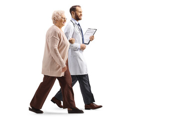 Wall Mural - Full length profile shot of an elderly woman walking and holding a doctor under arm