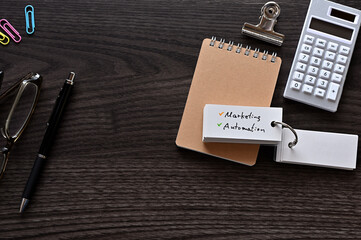 Leinwandbilder - There is word card with the word Marketing Automation on the desk.