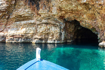 Boat trip view towards the famous caves of Votsi beach in Alonnisos island. Unique geological formation and rocky scenery in Sporades, Greece