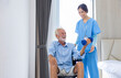 © Akarawut - Hospice nurse is helping Caucasian man in wheelchair to exercising muscle strength in pension retirement center for home care rehabilitation and post treatment recovery process