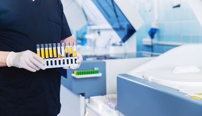 Wall Mural - scientist nurse downloads blood test samples to dna, hiv, aids, coronavirus on automatic biochemical