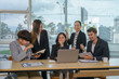 © amnaj - Meeting of Asian business people who are committed to work. Creative business team working together at office.