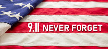 9 11 USA Never Forget. White Text On US America Flag. Patriot Day. Remember September 11, 2001.