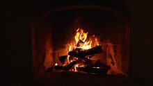Screen Saver Background. Burning Fire In The Fireplace. A Looping Clip Of A Fireplace With Medium Size Flames Winter And Christmas Holidays Concept