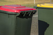 © Austockphoto - Close up of council bins waiting for collection