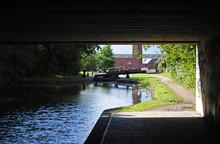 Canal Lock And Towpath Seen From Below Bridge
