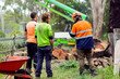 © Austockphoto - Three workmen on a short break, chatting and laughing together