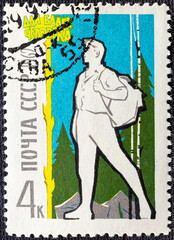 Wall Mural - Soviet Union - circa 1962 : Cancelled postage stamp printed by Soviet Union, that shows Hiker at Camp, circa 1962.