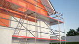 Fototapeta  - House and scaffolding - insulation concept 