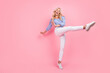 © deagreez - Full length photo of lovely adorable girl dressed blue top dancing walking isolated pink color background