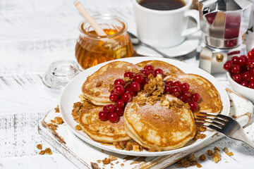 Sticker - delicious pancakes with berries and honey for breakfast on white table