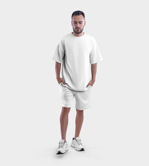 White suit template, oversized t-shirt, shorts on a guy with a beard, in sneakers, with hands in his pocket, walking, isolated on background, front.