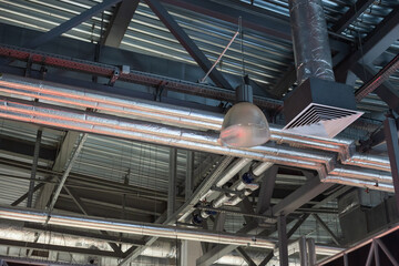 Supply grille for industrial ventilation in an office building under the ceiling, hvac engineering communications