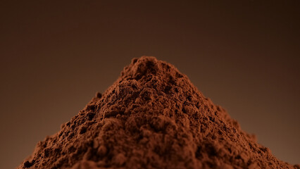 Wall Mural - Cocoa powder, close up. Confectioner prepares ingredient for dessert, sauce
