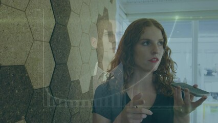 Poster - Caucasian woman talking on smartphone at office against businessman touching futuristic screen