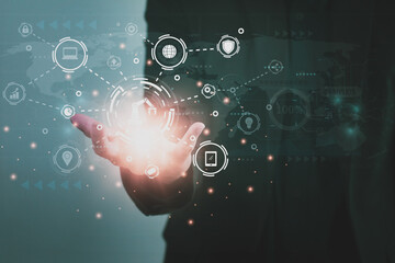 Wall Mural - engineer holding digital network icon,control automated robot arm machine in factory,machine learnin