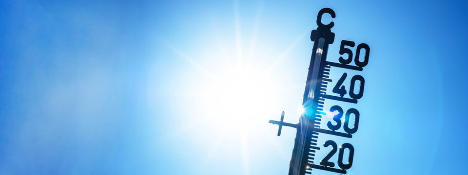Hot weather - Heat wave / Summer heat background banner panorama - Thermometer blue sky and sun rays