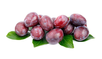 A group of ripe red-purple plums with leaves on a white background.