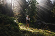 © ADDICTIVE STOCK - Woman hiker walking in forest