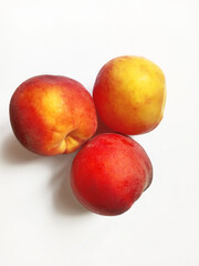 juicy ripe peaches on white background