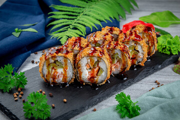 Canvas Print - Fried tempura sushi rolls with shrimp, cream cheese, gherkin in batter. Traditional Japanese Cuisine