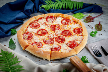 Wall Mural - Pepperoni pizza on a shovel. Freshly baked with sauce and mozzarella cheese