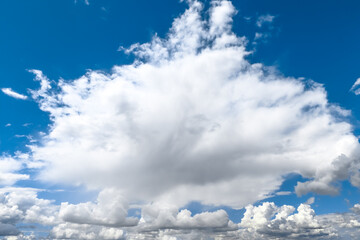 Wall Mural - White cumulonimbus clouds against the blue sky. Summer