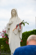 Statue Of The Virgin Mary, The Queen Of Peace, In Front Of The St James Church In Medjugorje, Bosnia And Herzegovina. 2021-08-03.