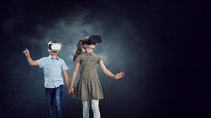 Wall Mural - Kids wearing virtual reality goggles
