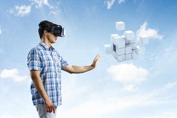 Wall Mural - Man wearing virtual reality goggles