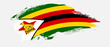 National flag of Zimbabwe with curve stain brush stroke effect on white background