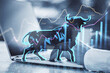 canvas print picture Concept of bullish market. Close up of businessman hands using notebook keyboard with glowing bull hologram over forex chart on blurry background. Trade and invest concept. Double exposure.