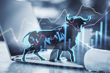 Poster - Concept of bullish market. Close up of businessman hands using notebook keyboard with glowing bull hologram over forex chart on blurry background. Trade and invest concept. Double exposure.