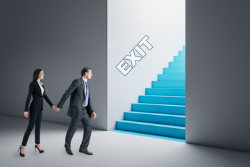 Canvas Print - Thoughtful young businesswoman and man in concrete interior looking at blue stairs exit. Way out, teamwork, solution and choice concept.